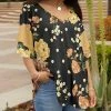 Lily | Black & Gold Floral Ruffle-Sleeve V-Neck Tunic - Plus