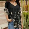 Lily | Black & Beige Floral Ruffle-Sleeve V-Neck Tunic - Women